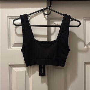 Aritzia Golden Body Hugging Seamless Sports Bra.